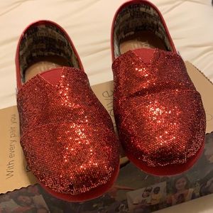 Toms Red Glitters Classics shoe.